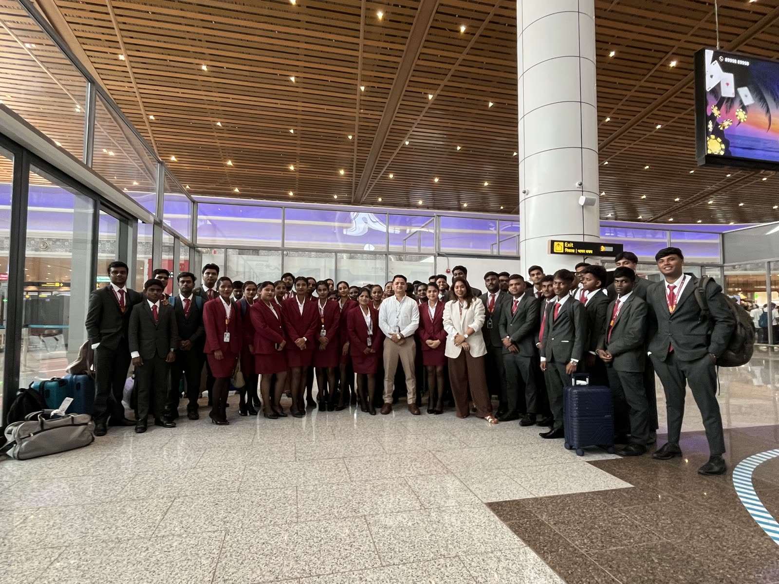 The full Brandcrew cohort in uniform inside an Airport terminal during an industry visit