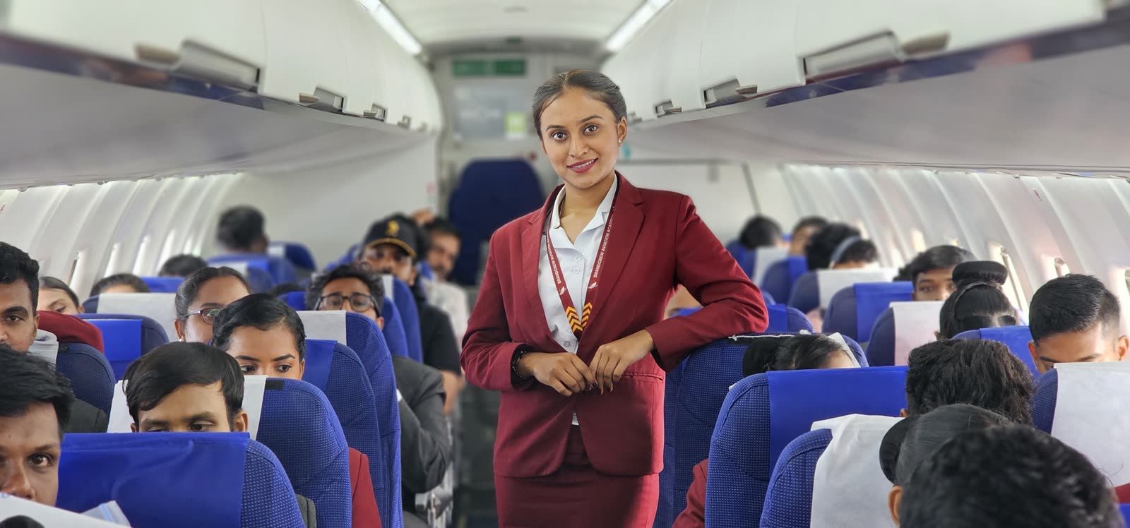 A trainee addressing a full cabin of students