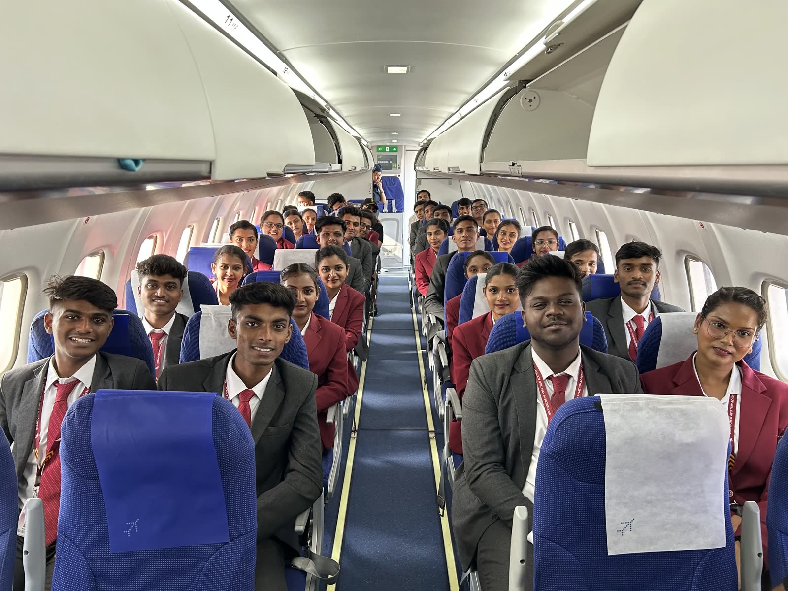 A full training flight cabin of smiling Brandcrew students