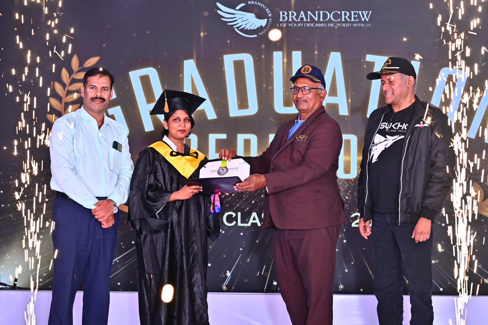 A Brandcrew student receiving their certificate at the graduation ceremony