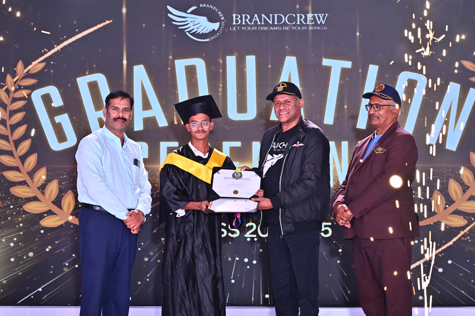A Brandcrew student receiving their certificate at the graduation ceremony