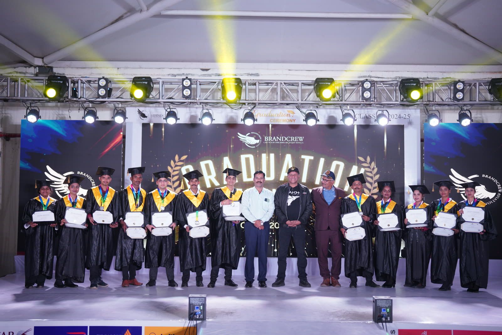 A Brandcrew student receiving their certificate at the graduation ceremony